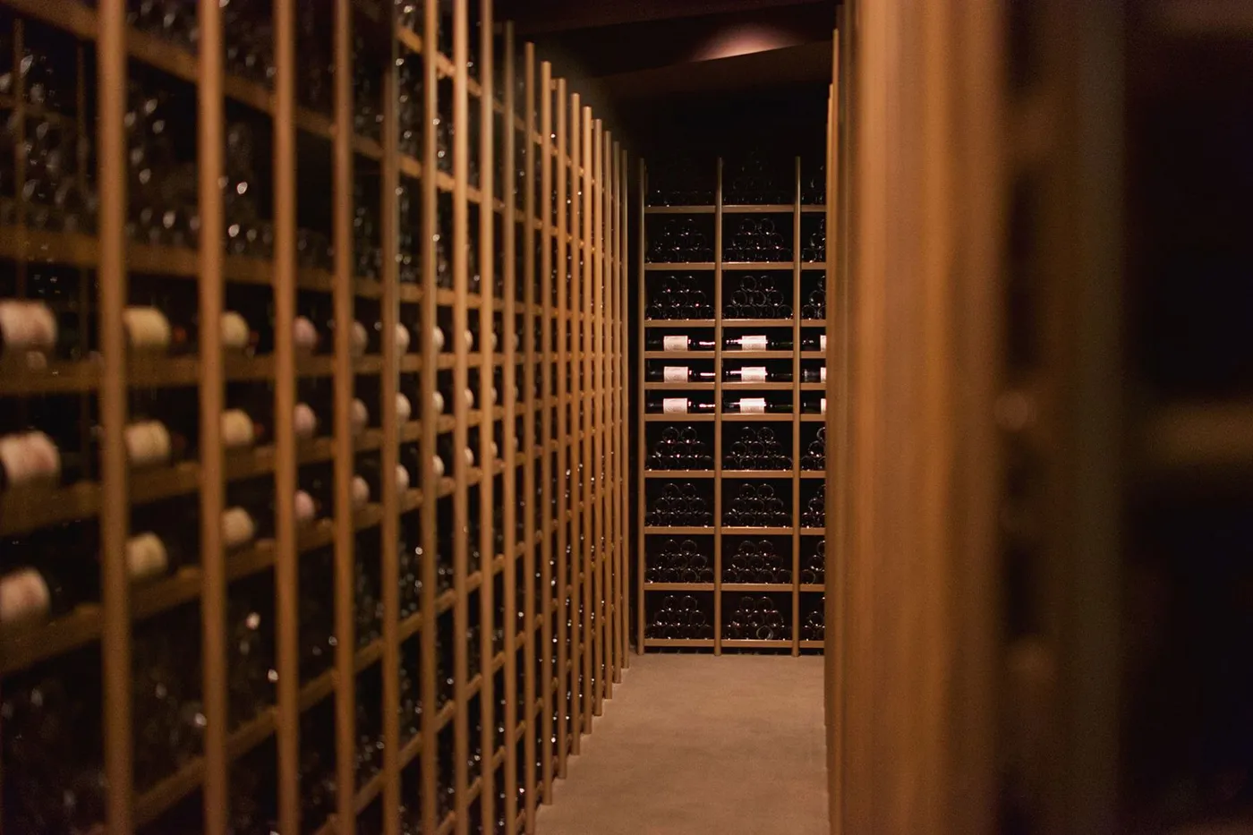 Elegant wine cellar with bottle displays and warm accent lighting